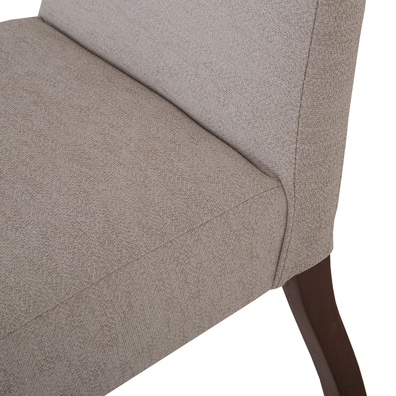 Silla de comedor Ikaro en color gris, con diseño moderno y respaldo ergonómico, ideal para comedor elegante.