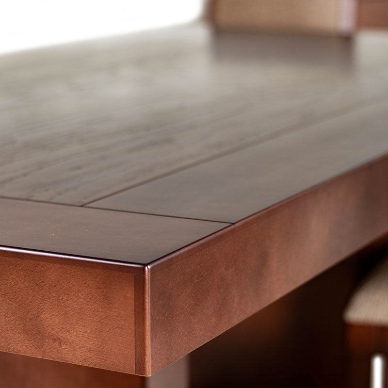 Juego de comedor Quetzal de 9 piezas en madera de nogal y encino, con mesa de 210 cm de largo en color café oscuro.