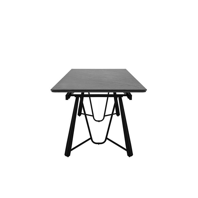 Mesa de comedor extensible Yad de Deurope con superficie de cerámica gris oscuro y base de pedestal metálico.