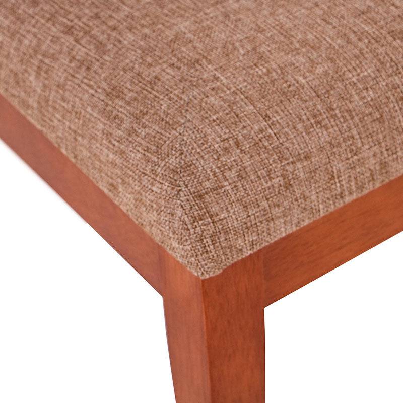 Juego de comedor Quetzal de 9 piezas con sillas tapizadas en tela, madera de nogal y estructura de color café.