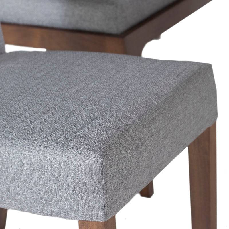 Juego de comedor Aragón con sillas de nogal y tapiz gris, estructura en madera de poplar, ideal para espacios elegantes.